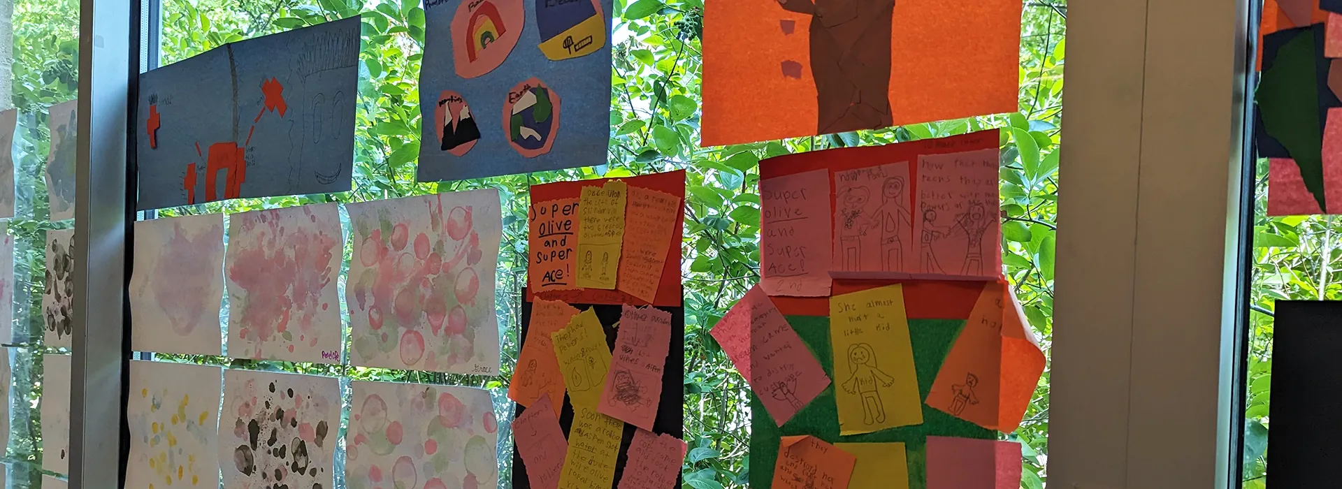 youth artwork hanging on a window